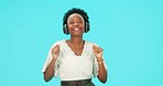 Music, dancing and black woman with headphones for listening in studio isolated on a blue background mockup space. Radio, streaming and happy person hearing podcast, sound and audio, media and smile