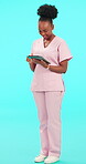 Doctor, woman and tablet for healthcare research, scroll clinic results and hospital management on a blue background. African nurse or medical professional on digital technology for service in studio