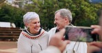 Elderly couple, park and phone photography with pose, comic smile and bonding with love, romance and care. Senior man, woman and smartphone for memory, profile picture or social network post on web