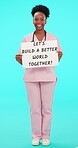 Smile, nurse and motivation with black woman and poster in studio for medical, support and message. Happy, healthcare and medicine with portrait of person and sign on blue background for nursing