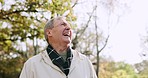 Nature, happy and senior man in park with smile for freedom, relaxing and sunshine for calm mindset. Retirement, garden and face of elderly male person outdoors for fresh air, wellness and health