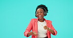 Dance, music and black woman with headphones, drums and listen in studio isolated on a blue background. Radio, streaming and happy person singing, sound and audio, moving with energy and mockup space