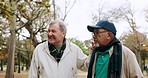 Nature, talking and senior men walking in an outdoor park for fresh air, exercise and bonding. Conversation, friendship and elderly male people in retirement having fun and exploring garden together.