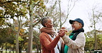 Old couple dancing in park, happiness and love with marriage, commitment and love with energy outdoor. Date in nature, romance and life partner, happy man and woman in winter with trust and bonding