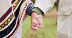 Holding hands, solidarity and trust with support and love in relationship, people outdoor with bonding and care. Partnership, commitment and couple with unity, together with respect and kindness