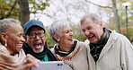 Funny, laughing and group of senior friends in a park or nature for outdoor holiday or vacation streaming video together. Joke, phone and elderly people happy for meme or comedy on social media