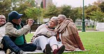 Picnic, park and senior people take picture for memories, social media and photography on grass. Retirement, friendship and elderly men and women with camera for bonding, relax and fun on weekend