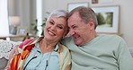 Hug, home or old couple on a couch, love or retirement with bonding, support or marriage. Romance, senior man or elderly woman on a sofa, embrace or romantic with commitment, relax or loving together
