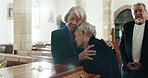 Funeral, church and women hug by coffin for goodbye, mourning and grief in memorial service. Depression, family and sad female people with casket in chapel for comfort, loss and burial for death