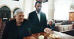 Funeral, coffin and senior woman with flower in church for goodbye, mourning and grief in memorial service. Depression, family and people by casket in chapel for greeting, loss and sad for death