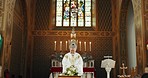 Funeral, church and pastor with prayer by coffin for memorial service, sermon and ceremony for death. Religion, guidance and male priest praying with congregation for comfort with casket in chapel