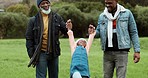 Family, swinging and park walk with grandfather, dad and child happy outdoor with fun. Care, African senior man and father with young kid and smile playing in a field on holiday together in nature