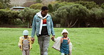 Dad, walking and children holding hands in park with parent in nature, outdoors in countryside together. Black family, siblings and father bonding or enjoying holiday vacation with kids, love or care