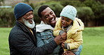 Grandfather, dad or happy child laughing in park with a parent in nature outdoors in countryside together. Black family or funny African dad playing or bonding on holiday vacation with kid or old man