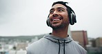 Thinking, fitness and man with music in the city, looking at view or idea for outdoor training. Smile, podcast and a male athlete or runner with headphones for cardio, exercise or plan for a workout