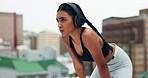 Fitness, headphones and woman breathe in city for training, running and exercise outdoors. Sports, rest and female person listening to music, track and radio for healthy body, wellness and workout