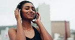 Happy, music and fitness with woman in city for streaming, audio and workout playlist. Sports, exercise and smile with person listening to headphones in outdoors for relax, wellness and training
