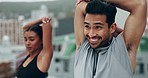 Couple, fitness and training on rooftop with stretching, health and smile with partnership, support or thinking. Young man, woman and workout together for start, muscle or happy with teamwork in city