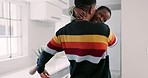 Black family, hug and happy father with child playing, bond and cheerful in together home together. Love, smile and boy kid with playful parent in living room for after school fun, embrace and game