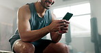 Gym, typing and a man with a phone in hands for fitness motivation, message or internet connection. Happy athlete person with smartphone and network for exercise app, communication or social media