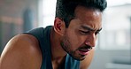 Fitness, fatigue and tired man at gym after workout, training for intense cardio routine. Sweat, exhausted and asian male athlete stop to breathe, recovery and rest during physical health exercise