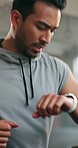 Fitness, treadmill and man running in the gym for race, speed or marathon training workout. Sports, health and male athlete runner doing a cardio exercise on an electric machine in a sport center.