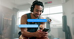 Chat, music or happy man in gym with a phone for social media, digital search or networking. Smile, overlay or Asian male person texting on mobile app for conversation or podcast in fitness training