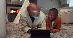 Tablet, streaming and grandfather with child in home for watching tv, cartoon and time to relax together in living room. African, senior man and talking to family about technology, movies or games