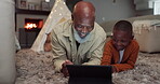 Happy, grandfather and kid with tablet in home for streaming, watching tv or time relax together in living room. African, senior man and family bonding with technology or cartoon, movies and games 