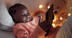 Girl, tablet and child in bedroom at night gaming with online, mobile app or typing on internet, website or social media. African kid, playing and search for games to relax on technology in home
