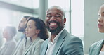 Face, smile and a business black man in a conference with colleagues for training during a workshop. Portrait, audience and male employee in a seminar for planning or coaching with an employee team