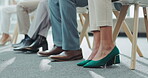 Nervous, anxiety and feet of business person with stress in a hiring or job interview waiting room for recruitment. Closeup, legs and professional or corporate people in a queue for an opportunity