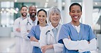 Crossed arms, pride and face of group of healthcare workers standing in medical hospital with confidence. Happy, diversity and portrait of team of professional doctors in hallway of medicare clinic.