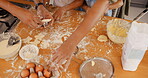 Hands, heart and ingredients with a family baking in the kitchen of their home together closeup from above. Food, cooking and flour with people learning about meal preparation for child development