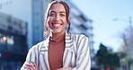 Face, business and woman with arms crossed, city and smile with professional trust, commute and success. Portrait, person and employee in an urban street, town and travel with a career and consultant