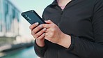 Woman, phone and hands typing in city for outdoor communication, networking or online browsing. Closeup of female person chatting, texting or scrolling on mobile smartphone app in an urban town