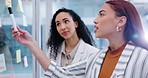 Business women, communication and brainstorming on glass in office for calendar, agenda and planning ideas. Team talking at window for schedule, timeline and mindmap for mission, feedback and process