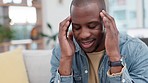 Anxiety, headache and black man on sofa with temple massage for brain fog in his home. stress, migraine and African male frustrated by vertigo, pain and mental health, worry or crisis in living room