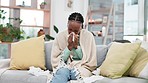 Sneeze, blowing nose and black woman on a sofa with tissue, flu or virus infection, influenza or bug in her home. Disease, bacteria and African lady sneezing with tuberculosis, pneumonia or allergies