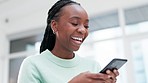 Woman, laugh and typing on smartphone in home, reading social media joke and multimedia connection from below. Face, african person and search funny meme on cellphone, download digital app and chat 