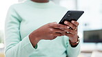 Woman, hands and scroll on smartphone in home, reading social media post and subscription online. Closeup of person typing chat on phone, download mobile games and search digital network for tech app