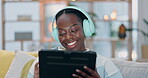 Tablet, home and black woman listening to music, sound track or radio network for stress relief. Podcast, headphones and African person scroll online for audio mp3 choice, playlist or song in lounge