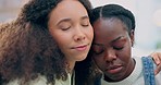 Sad lesbian women, hug and support in home with kindness, care or talking with love, empathy or solidarity. Young gay couple, embrace and conversation with grief, mental health or depression in house