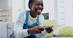 Black woman, video game and energy with competition and excited with gaming, cyber space and relax at home. Young gamer on sofa, playing and streaming online with controller, action and challenge