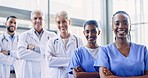 Face, black woman or medical team with arms crossed, group and smile in a hospital, career and diversity. Portrait, healthcare professionals and happy staff with collaboration, clinic and doctors