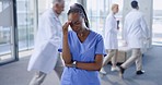 Headache, nurse and black woman with stress in hospital for burnout, overworked and fatigue. Healthcare, busy medical clinic and health worker with injury, strain and migraine for anxiety or crisis