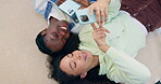 Friends, phone and women talking about social media, multimedia or gossip on internet. Diversity, above and people together with a smartphone for a chat, communication and network on a floor at home