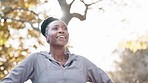 Black woman, breathing and nature with exercise and meditation outdoor, peace and calm with mindfulness. African person in the park, fresh air and zen with fitness, sunshine and health with wellness