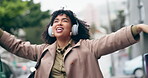 Music, headphones and woman dance with shopping bags in the city, street or excited about sales, discount and deal. Happy, customer or singing shopper walking in town and listening to radio song