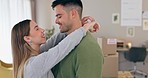 Property, success and couple dance in celebration of new house, moving or investment. Real estate, love and man dancing with happy woman in living room celebrating apartment, rent or mortgage loan
